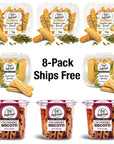 Eight True Delicious "Bundle of the Month" non-GMO cookies are arranged in two rows: pumpkin spice and sweet corn flavors on top, cranberry biscottis below. Center text reads: 8-Pack Ships Free.