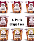 Eight tubs of True Delicious Bundle of the Month natural cookies in cranberry, double chocolate, and salted pistachio are arranged around “8-Pack Ships Free” text—your perfect biscotti bundle with free shipping.