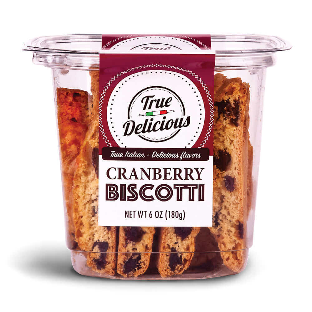A clear plastic container of True Delicious Cranberry Biscotti, handcrafted and baked with dried cranberries. The maroon and white label reads: True Delicious Cranberry Biscotti, Net Wt 6 oz (180 g).
