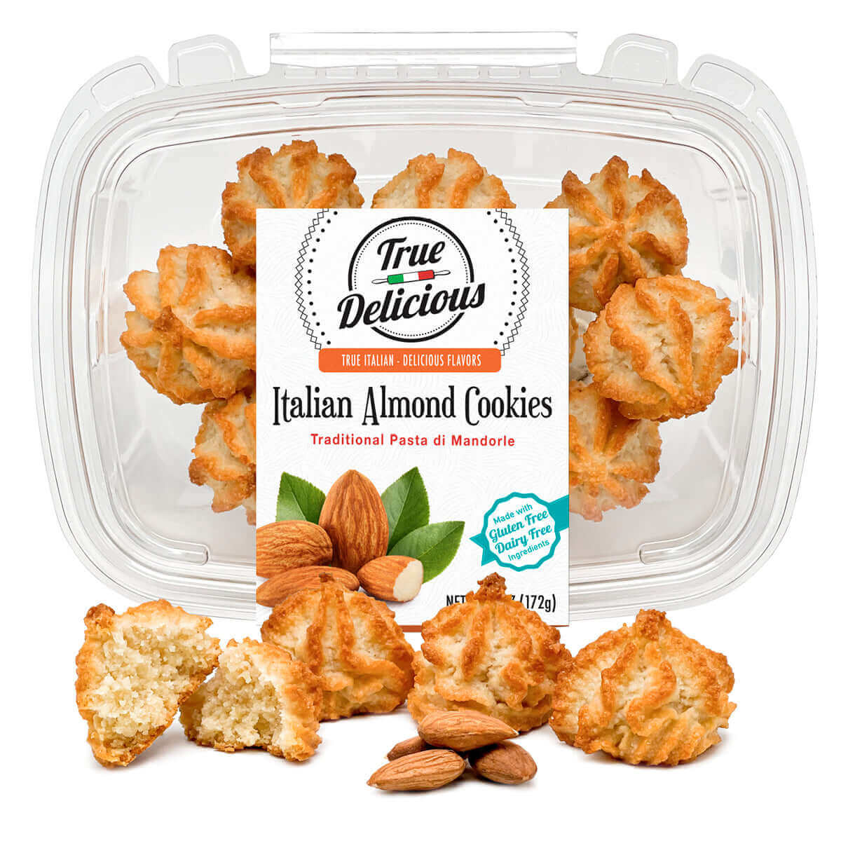 A clear plastic container displays True Delicious Italian Almond Cookies, made from a classic Sicilian recipe, with golden brown cookies and whole almonds inside and in front, plus a label noting gluten-free and dairy-free features.