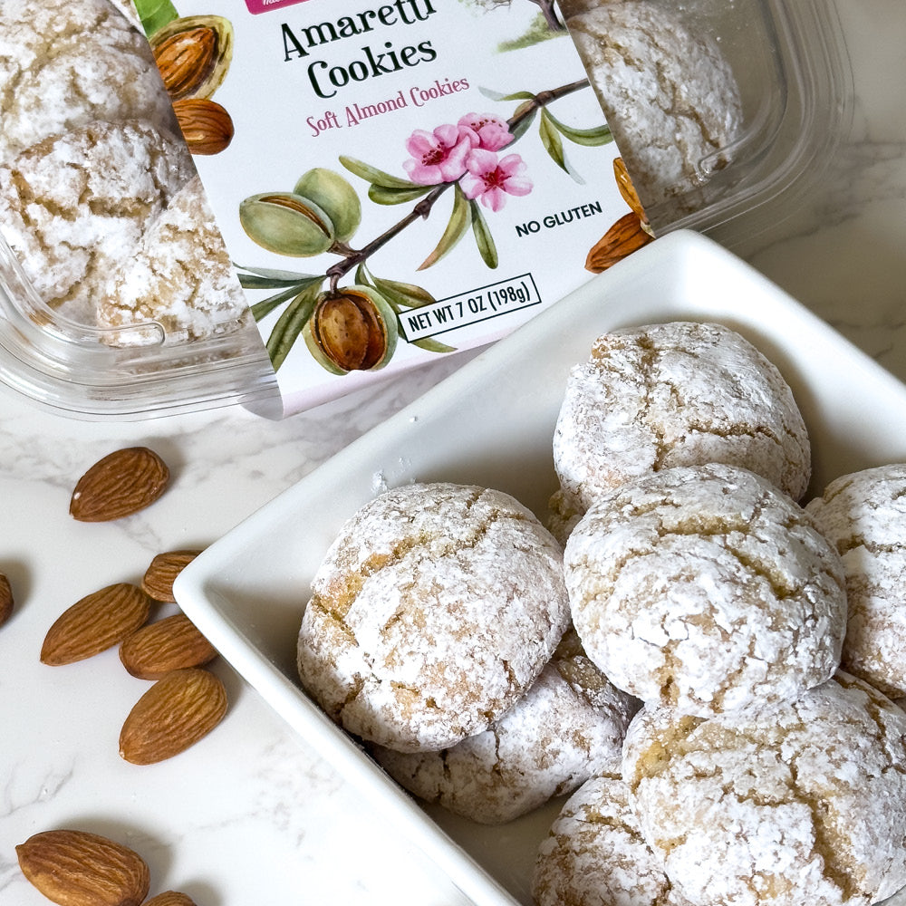 A bowl of True Delicious Amaretti (gluten-free) cookies and almonds.
